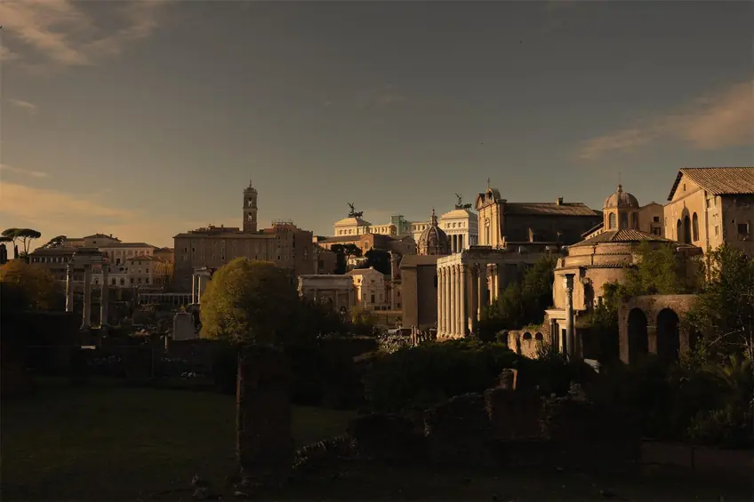 Captivating sunset view of historic Roman buildings, capturing ancient charm and architectural beauty.