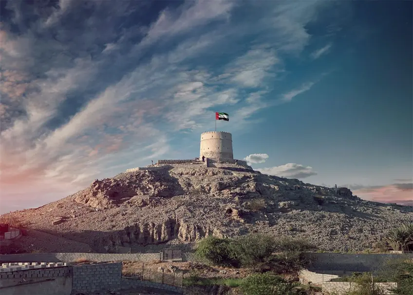 Majestic view of the Hatta Tower under a scenic sky, highlighting UAE's heritage.