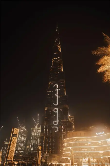 Dramatic night view of the illuminated Burj Khalifa in Dubai, showcasing the vibrant city skyline.